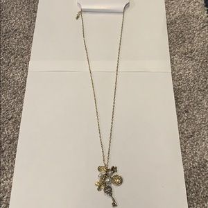 NWT charm necklace 13” with key gold colored